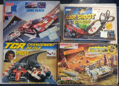 several toy cars are lined up on a table in a display case