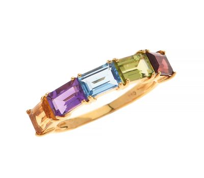 a close up of a gold ring with multi colored stones