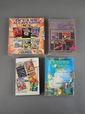 three video games are sitting on a table next to each other