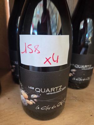 several bottles of wine are lined up on a table