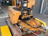 a machine that is sitting on a pallet in a garage