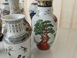 four vases that are sitting on a table