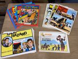 a lot of comic books on a table on the table