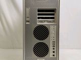 a close up of a computer tower with two speakers on top of it