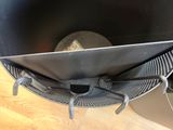 a metal basket with a metal handle on a wooden table