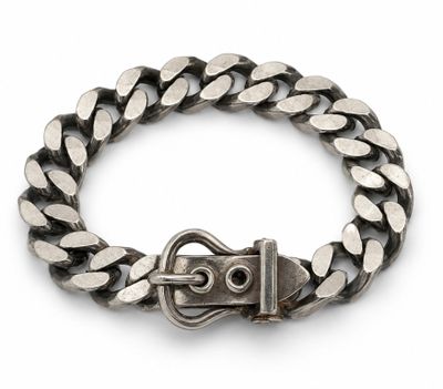 a close up of a metal bracelet with a buckle on it