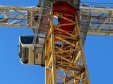 a crane that is standing on top of a building