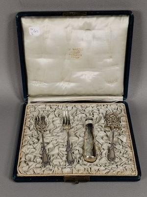 a silverware set in a case on a table