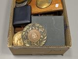 a box with coins, a wallet, and other items in it