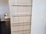 a display case that has glass shelves on it