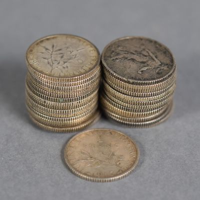several stacks of coins sitting on top of each other on a table