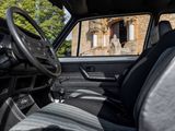 the interior of a car with a view of a building in the background