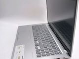 a laptop computer sitting on top of a white table