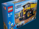 a box of lego city construction vehicles on a blue background