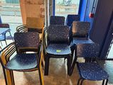 many chairs that are sitting in front of a window
