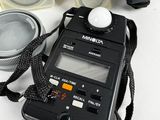 a camera and other electronics on a white table