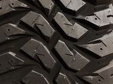 a close up of a tire on display in a store