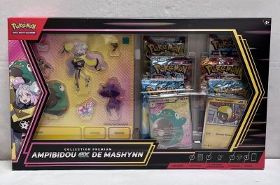 la boîte est ouverte pour montrer le contenu du jeu de cartes Pokémon