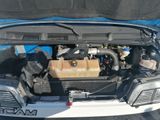the engine of a car with its hood open and the hood up