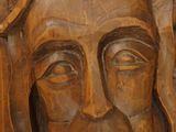 carvings of a man with a crown of thorns on his head
