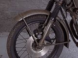 a motorcycle that is parked on the side of the road