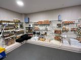 a store with shelves of various types of goods