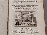 an open book with a picture of a man and a woman in a kitchen