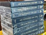 books stacked on top of each other on a yellow table