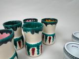 four cups that are sitting next to each other on a table