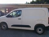 a white van that is parked in a parking lot
