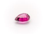 a pink sapphire stone on a white background