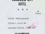 a ticket for the walled off hotel with a barcode on it