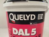 a close up of a bucket of dal 5 paint on a table