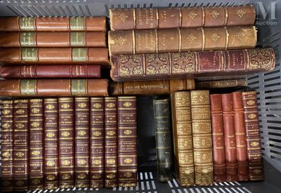 many old books in a metal basket on the shelf