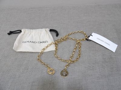 a close up of a bag with a chain on it