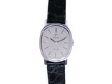 a close up of a wrist watch with a black strap