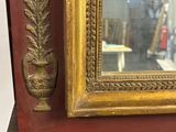 a mirror that is sitting on top of a shelf