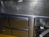 a stainless steel counter top in a commercial kitchen