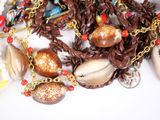 a necklace with a lot of shells and beads on it