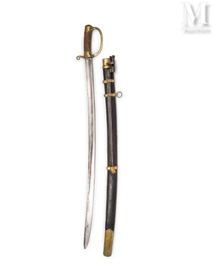 an old sword with a wooden handle and brass fittings