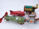 three toy airplanes that are sitting next to each other