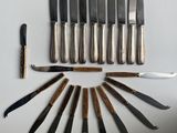 a lot of knives and knives that are on the table