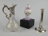 two vases and a candle holder on a table