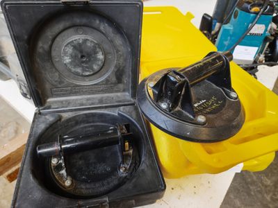 a yellow box with a black handle and a yellow container with a black handle