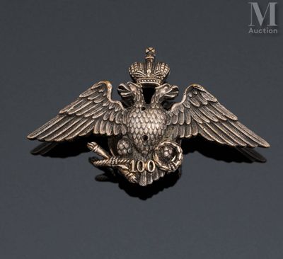 a close up of a metal bird with a crown on it ' s head