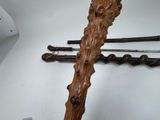 a cross made out of wood and a bunch of sticks