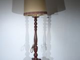 a lamp that is sitting on the floor in the room