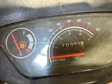 a close up of a speedometer on the dashboard of a motorcycle
