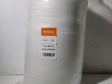 a large roll of white paper sitting on a counter