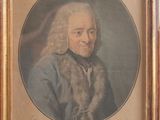 an old picture of a man with a fur collar in a wooden frame